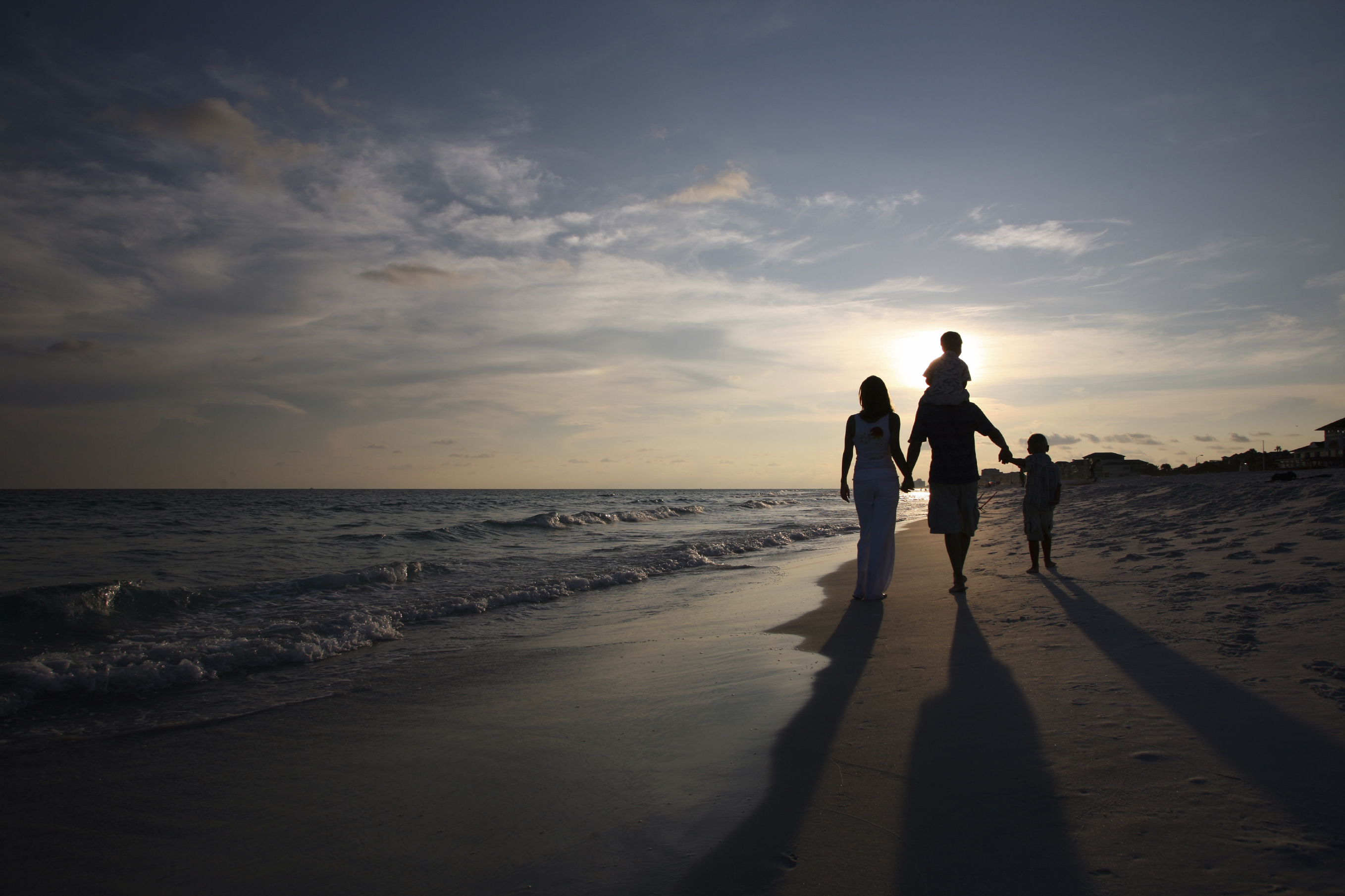 Family Strolling on Seashore
