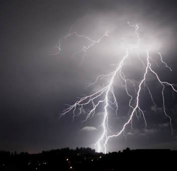 Town Under Lightening in Raining Weather