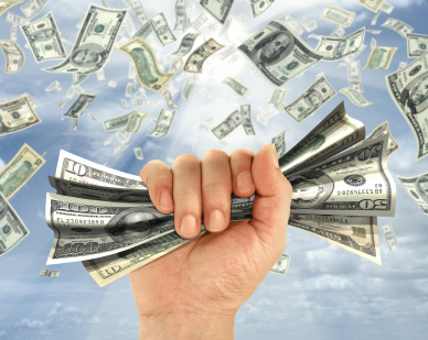 Hand Grabbing Dollar Bills
