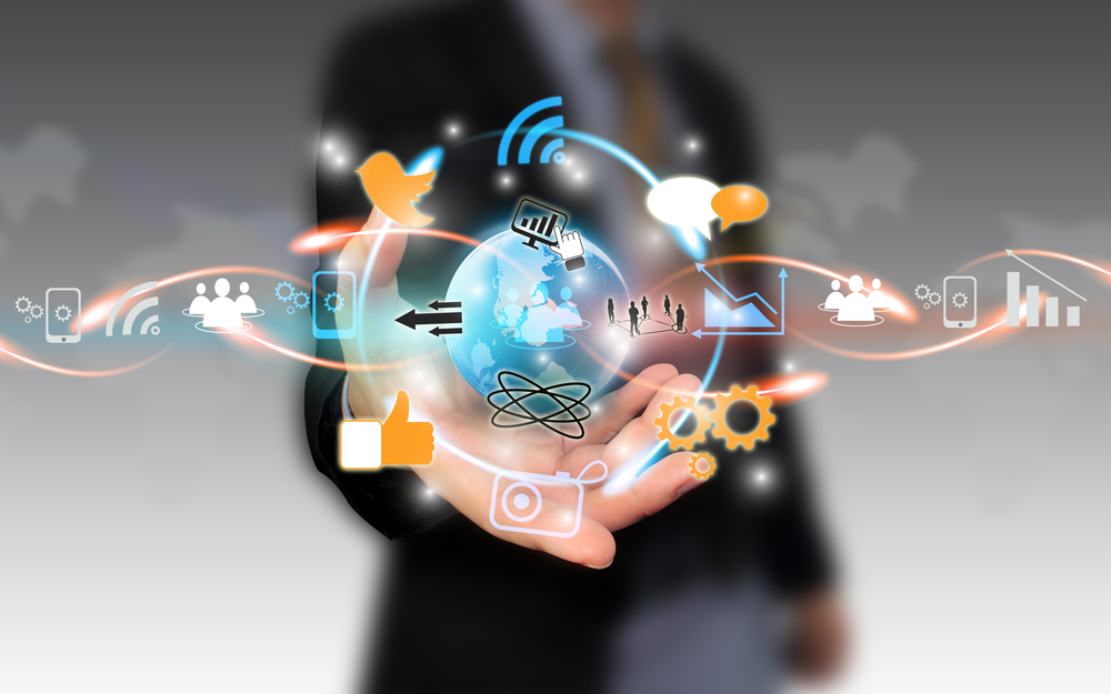 social-media-survival-guide Man holding social media icons in his hand