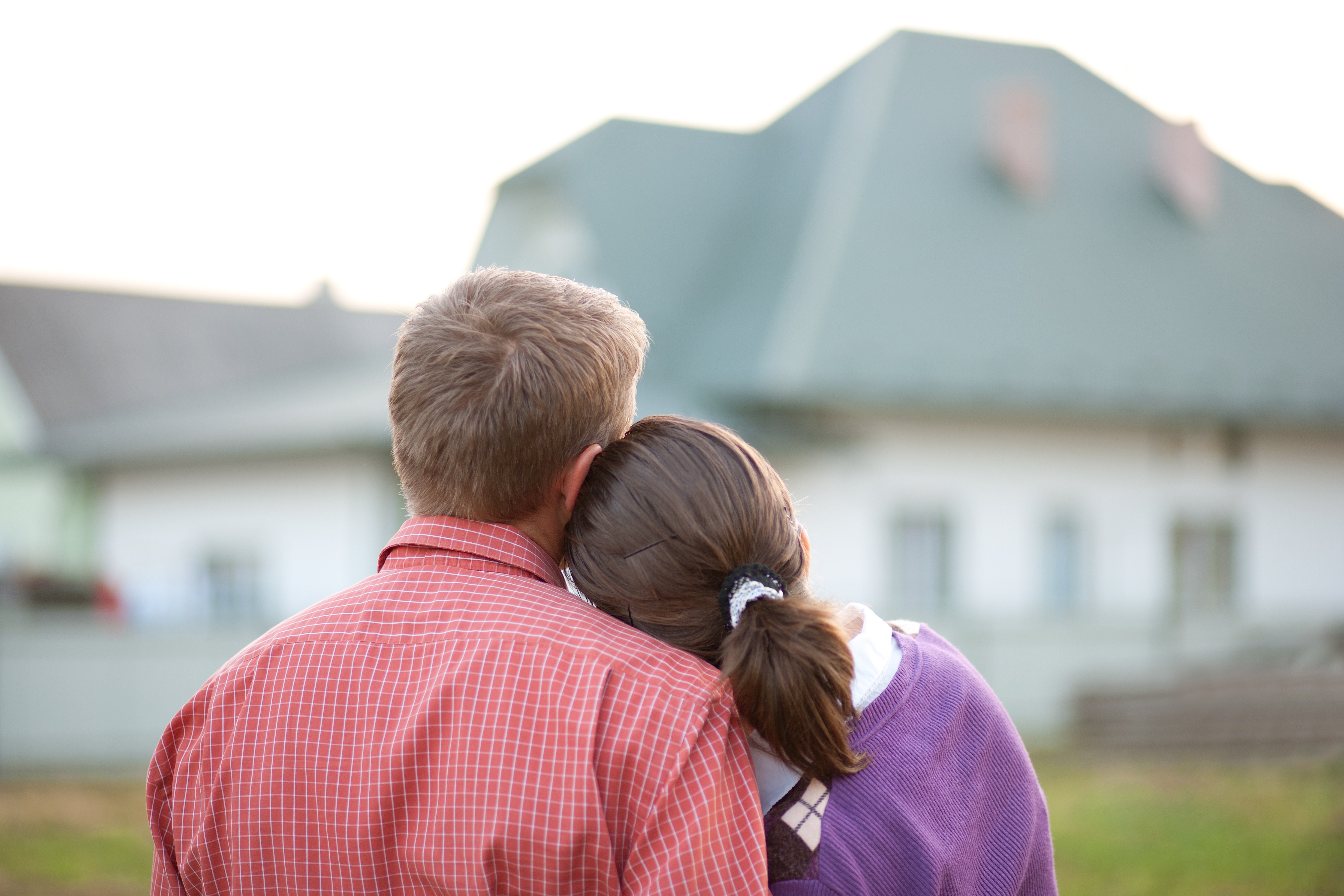 millennial-homebuyers Couple in front of house.