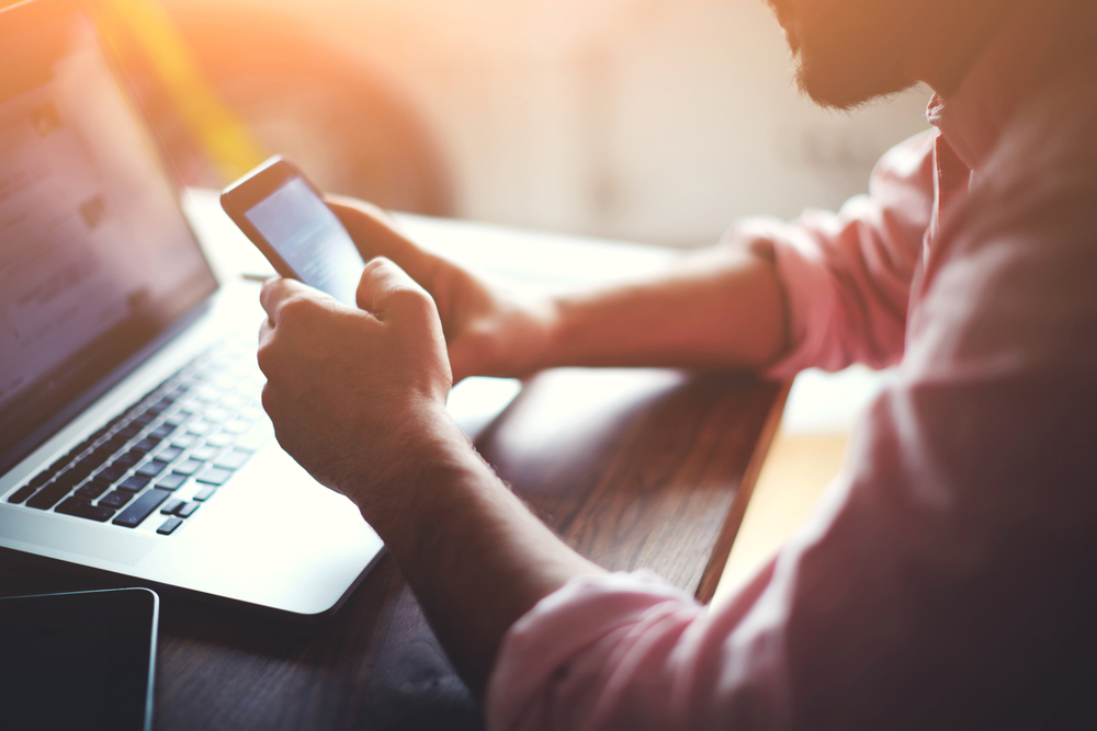 homebuyers-arent-buying Man using cell phone